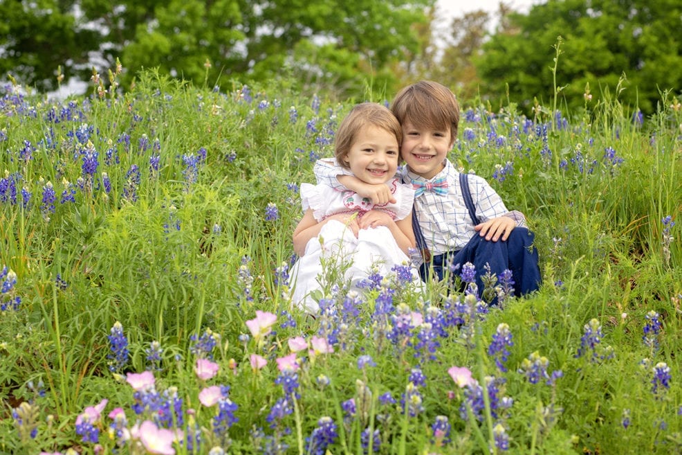 children in the bluebonnets at Northwest Park in Austin, TX