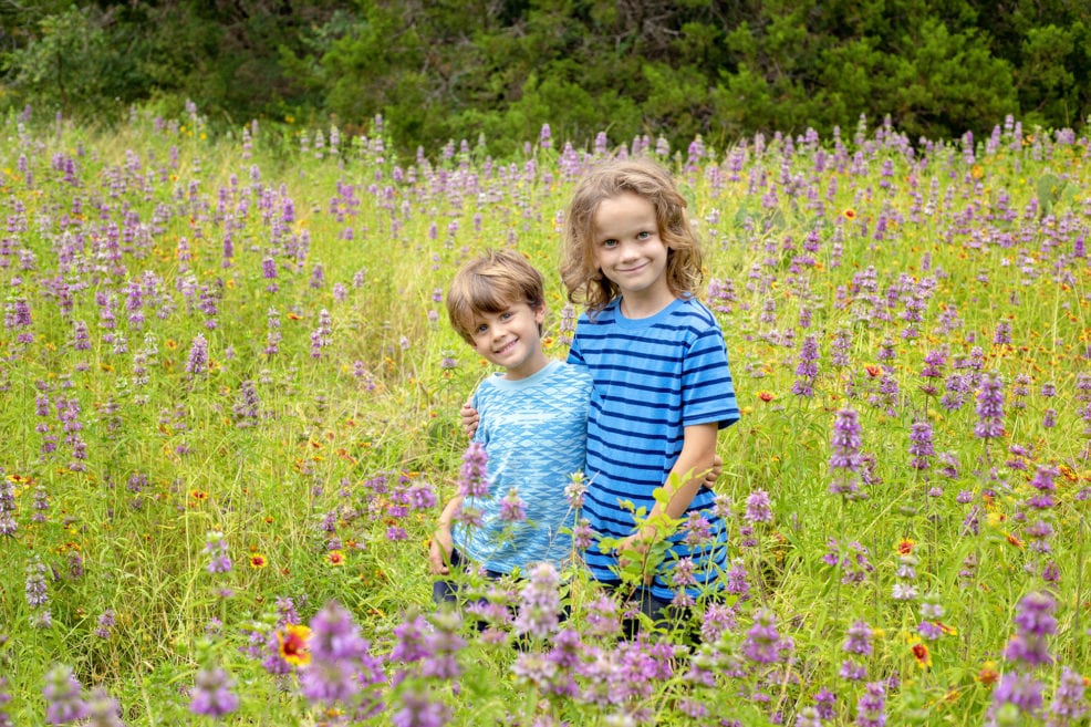 brothers in wildflowers at St. Edwards Park in Austin in Spring 2019