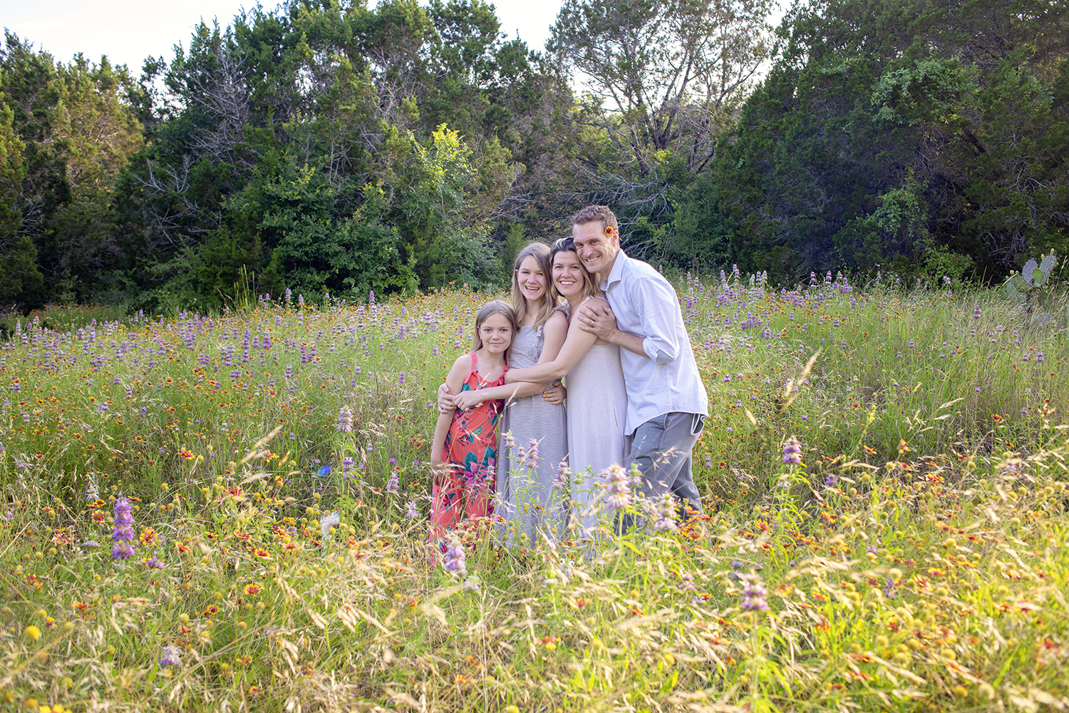 family in wildflower at St. Edwards Park in Austin, TX