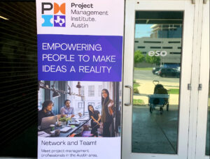 PMI banner in front of doors