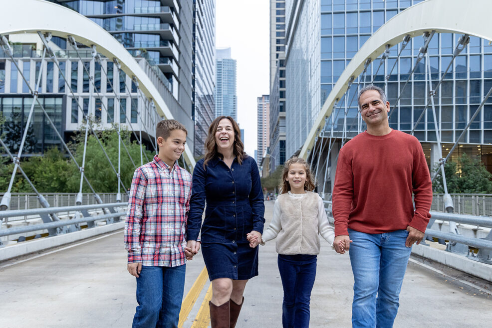 walking the butterfly bridge in downtown austin for a family photo session