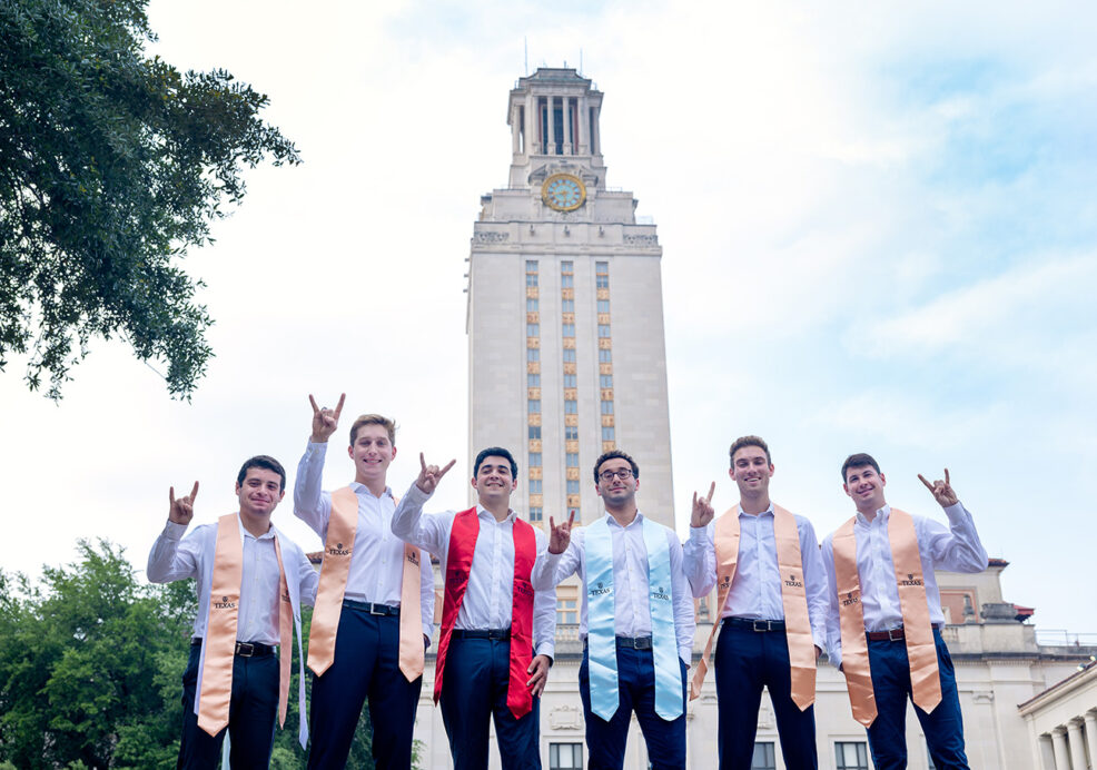 six college seniors in front of the tower at the university of texas at austin