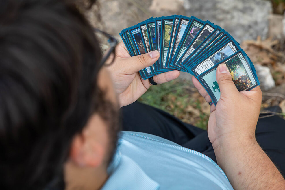 magic the gathering cards at senior photo session for graduation high schooler