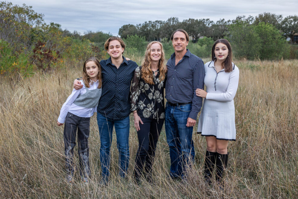 family of five at mueller greenway park for photo session