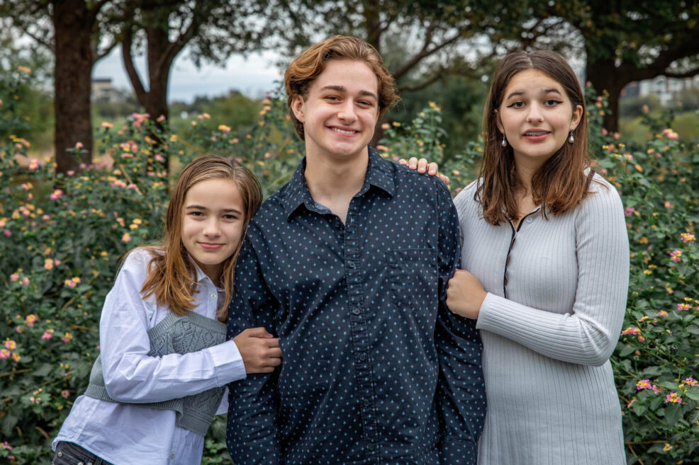 three siblings in flower garden for family photos in austin, texas by stephanie friedman photography
