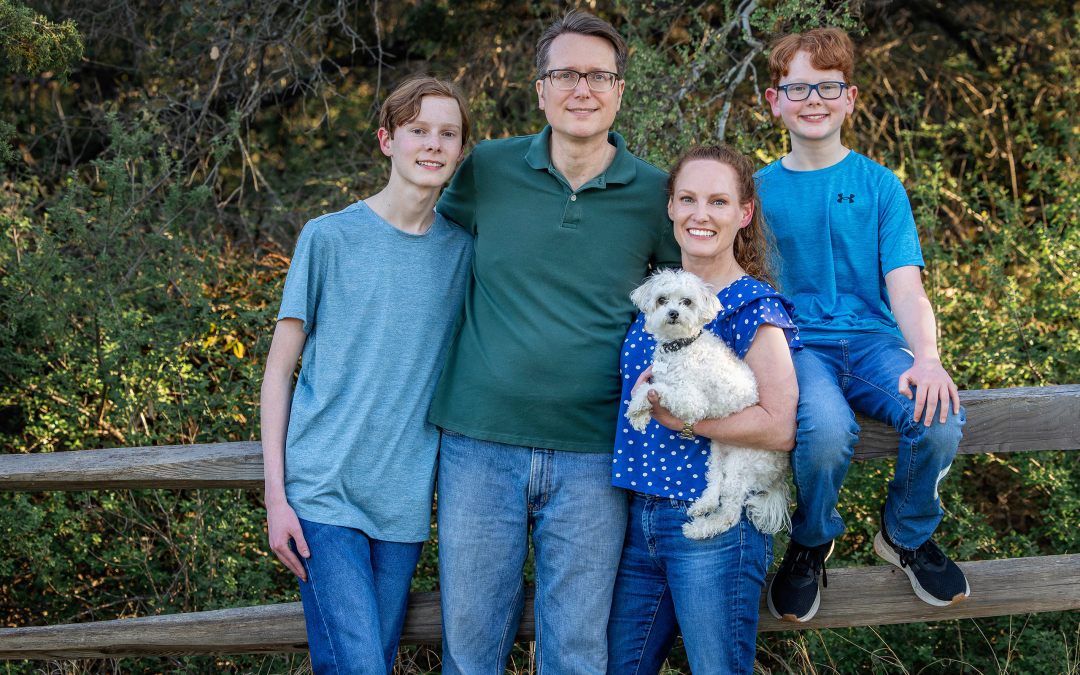 family of four holding pet dog during their family photo session