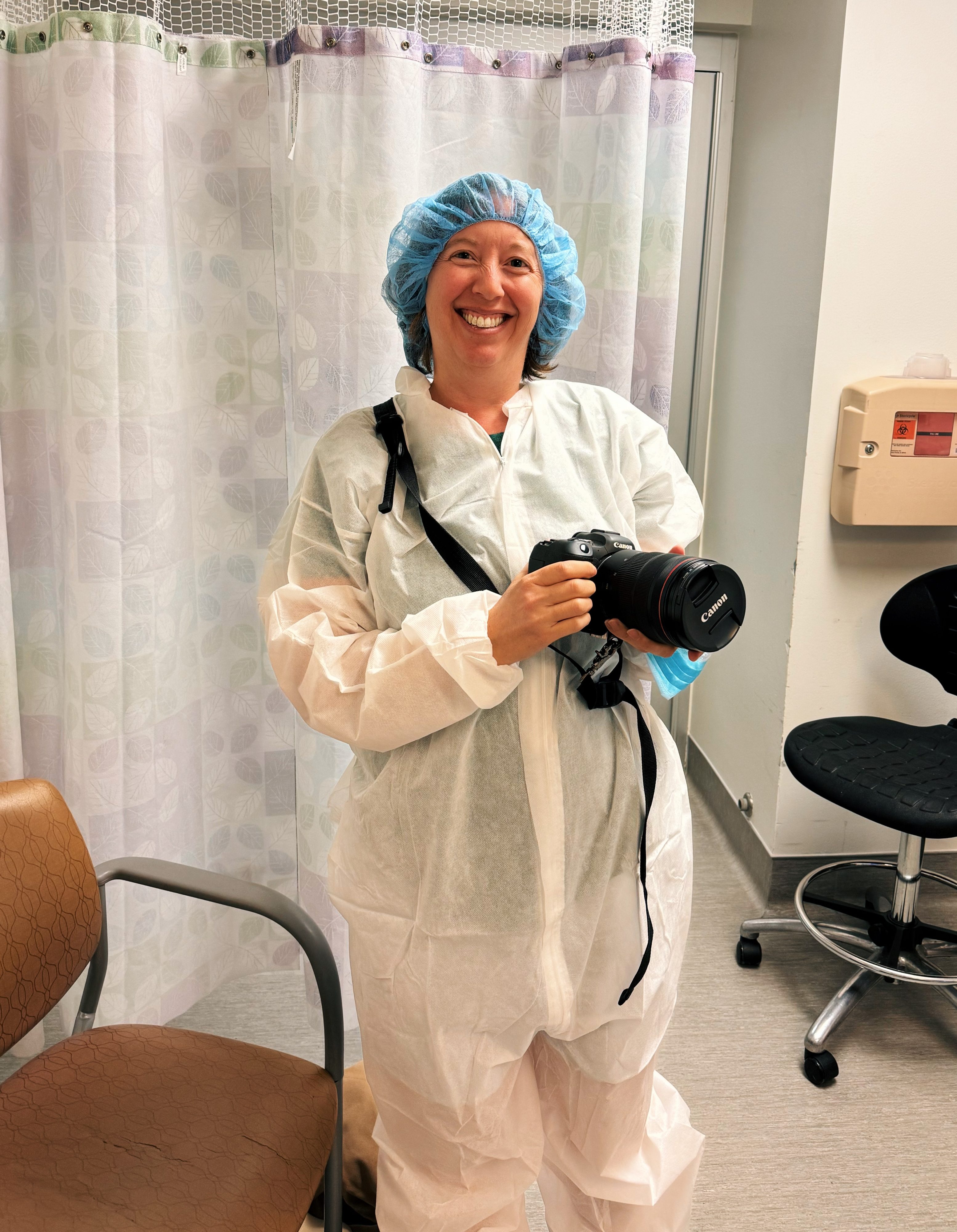 photographer dressed in scrubs for c-section photo session at hospital