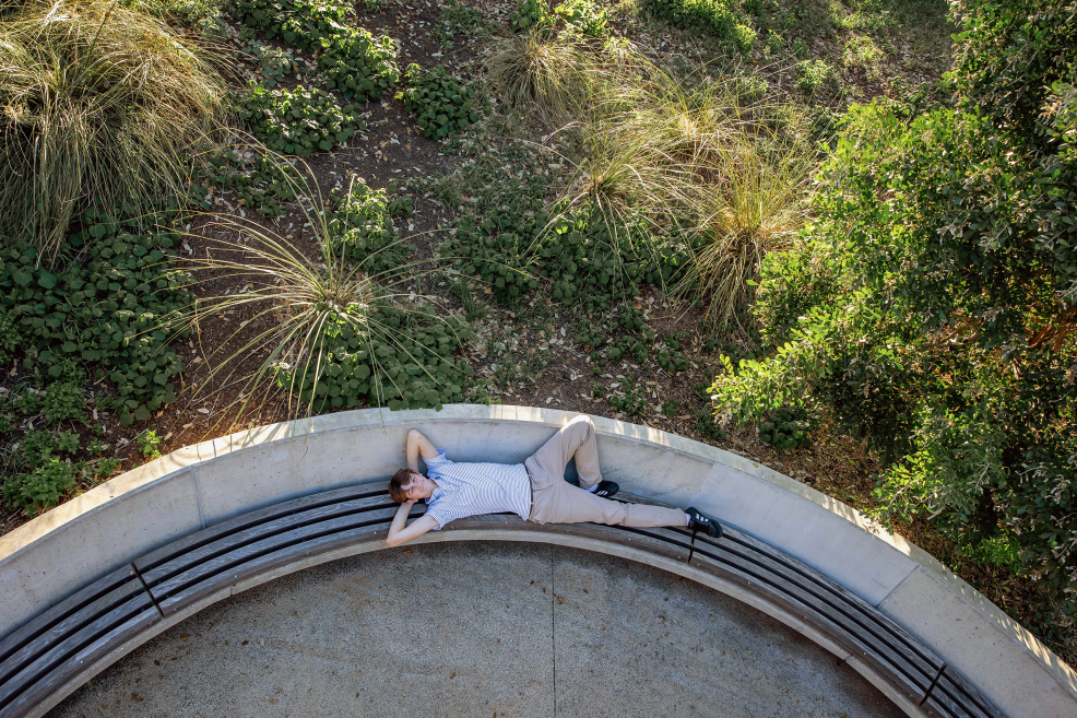 high school senior boy posing at waterloo greenway park in downtown austin