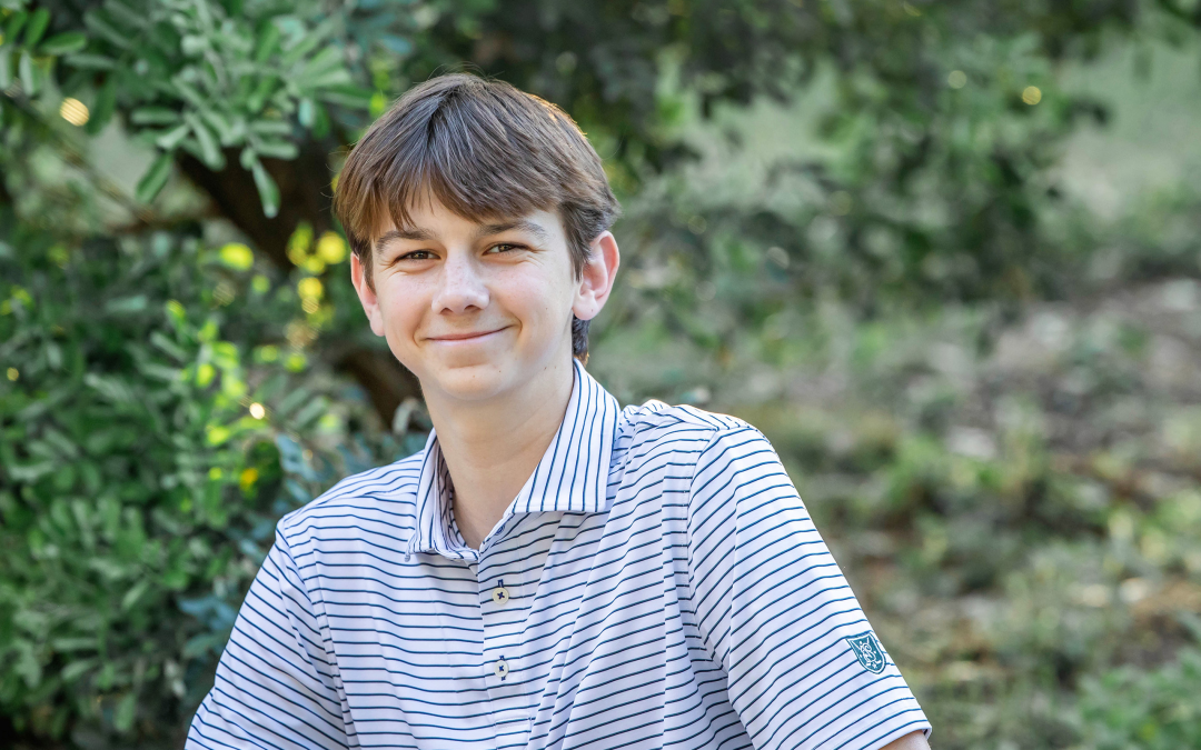 senior boy at waterloo greenway park for photos in austin