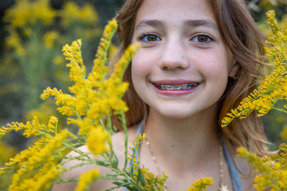 yellow fall flowers at family photo session at park